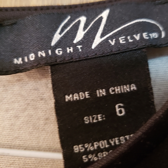 Very pretty black dress with orange/red floral pattern on the bottom. - Picture 6 of 6